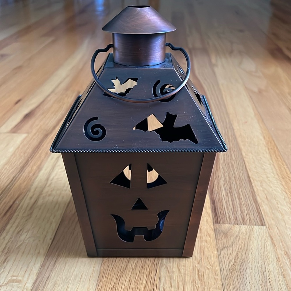 Copper-tone Halloween Jack-o-lantern.  Includes tea light.